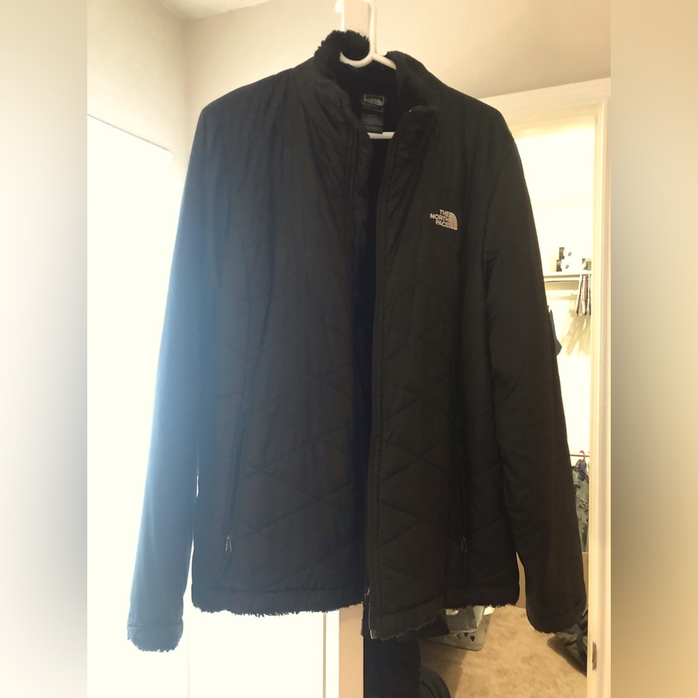 North Face jacket with cozy warm fur inside and a water resistant outer.